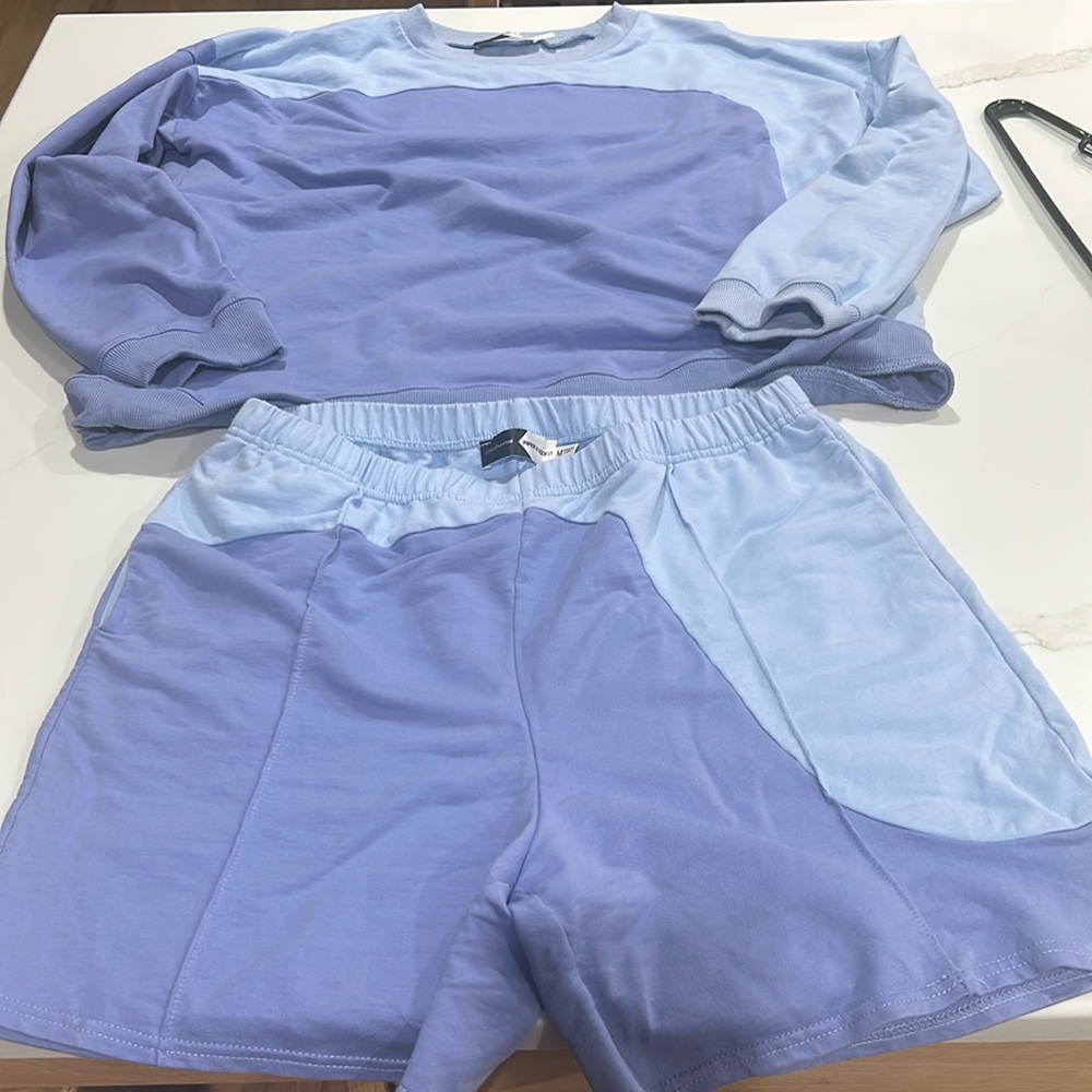 Piper and scoot shorts and crew neck shirt.  Large top medium bottoms. Used good